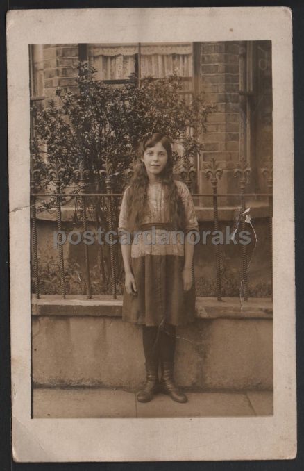 Girl Standing By Railings Vintage Postcard